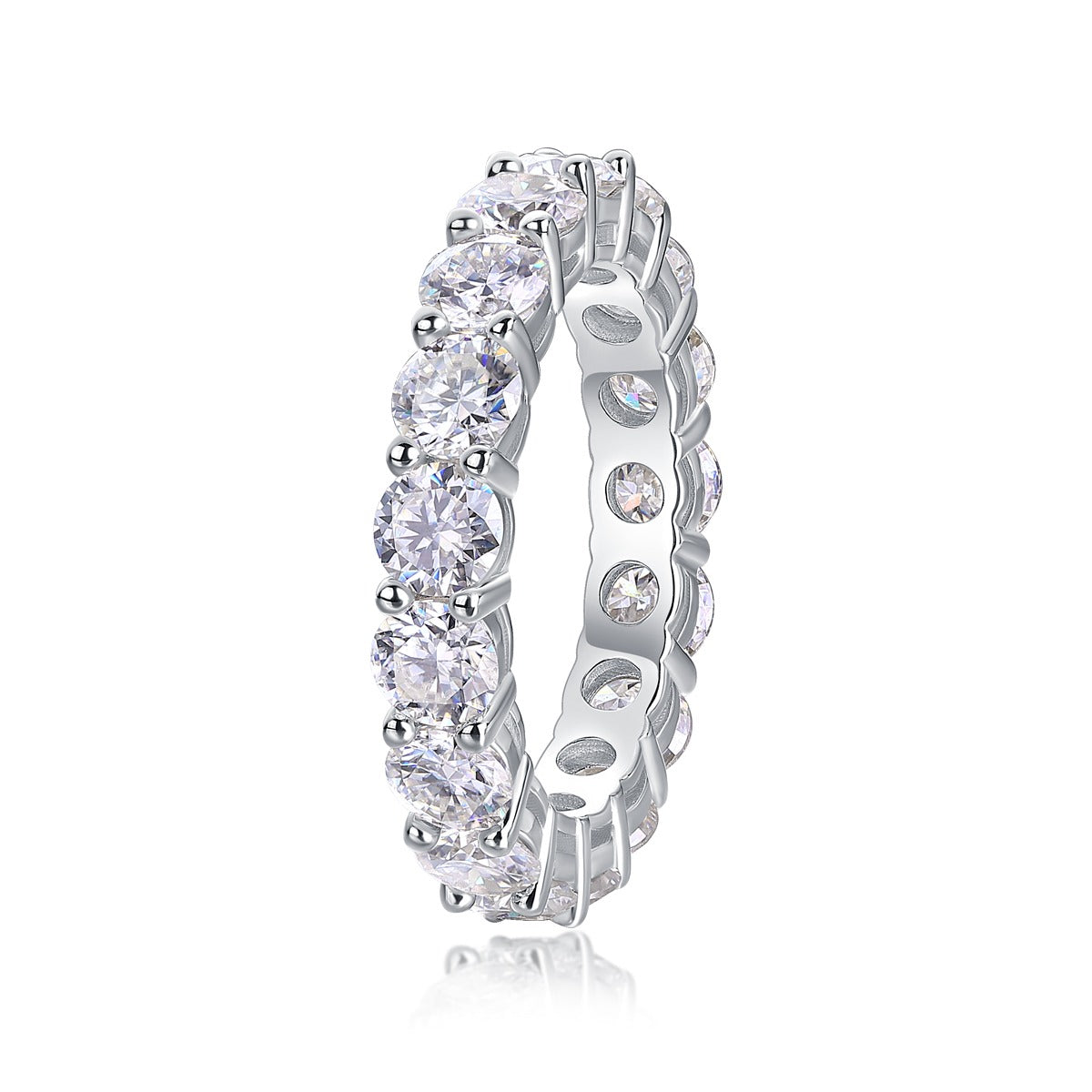 Silver ring with clear gemstones on a white background