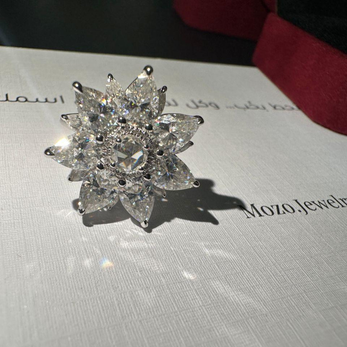 Diamond ring on a Mozo Jewelry branded box