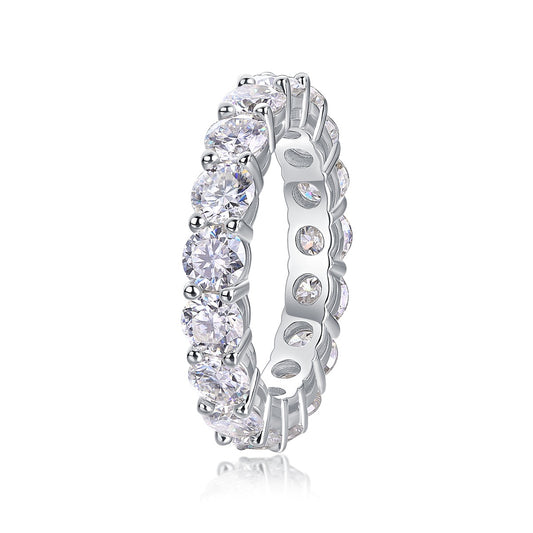 Silver ring with clear gemstones on a white background