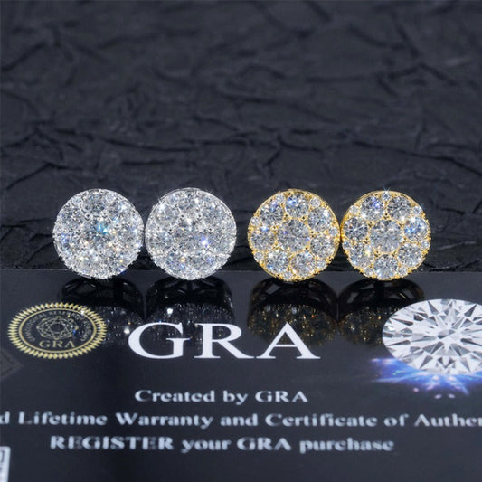 Pair of diamond earrings on a GRA branded card with a dark textured background