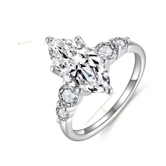 Silver ring with clear gemstones on a white background